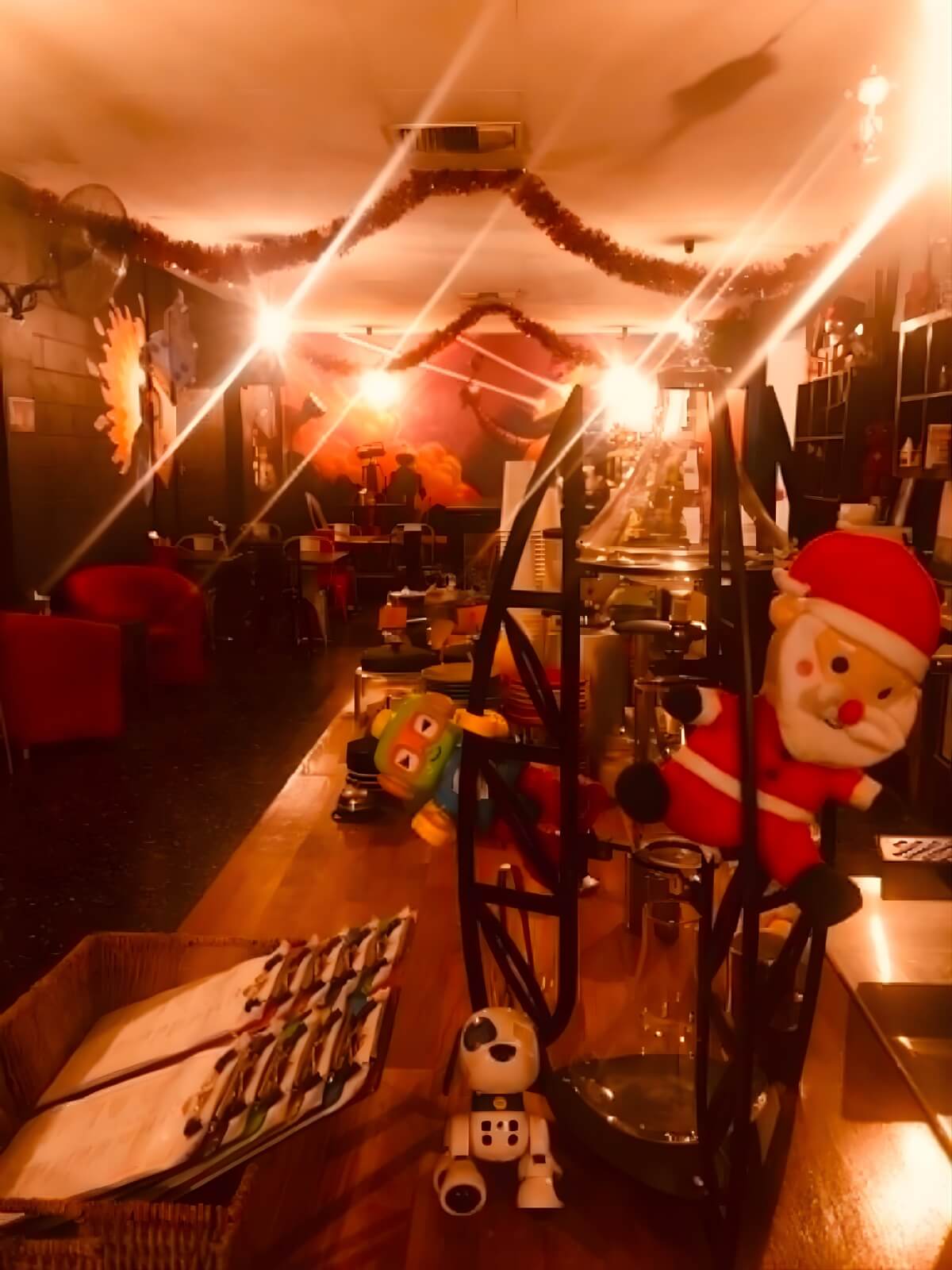 Warm Christmas cafe interior with robot decorations at The Robot Bun Factory
